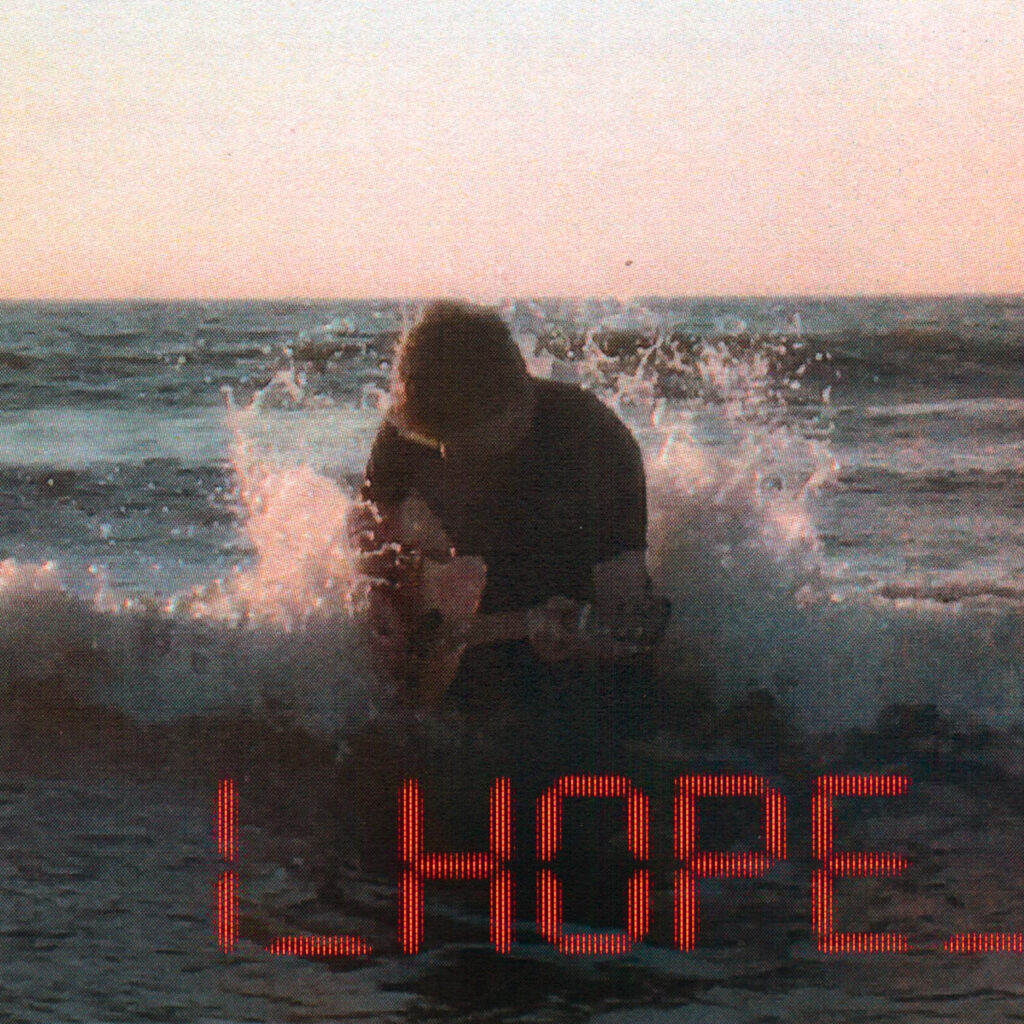 I_HOPE_ by culi. Picture of man in ocean with guitar